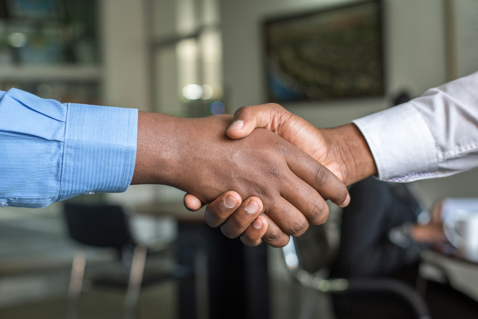 Professional handshake symbolising advisory partnership